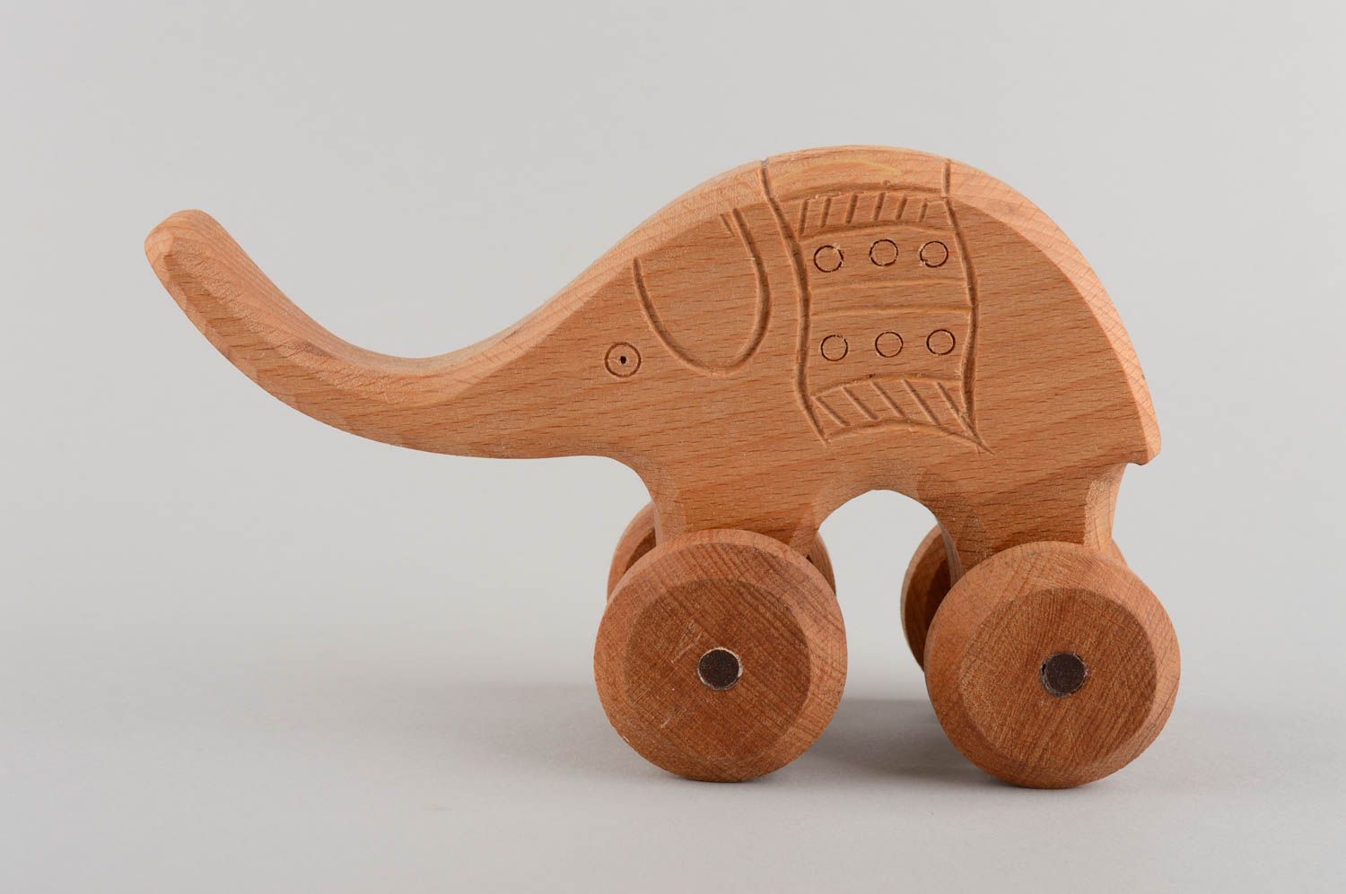 Handmade children's wooden wheeled toy elephant educational photo 3