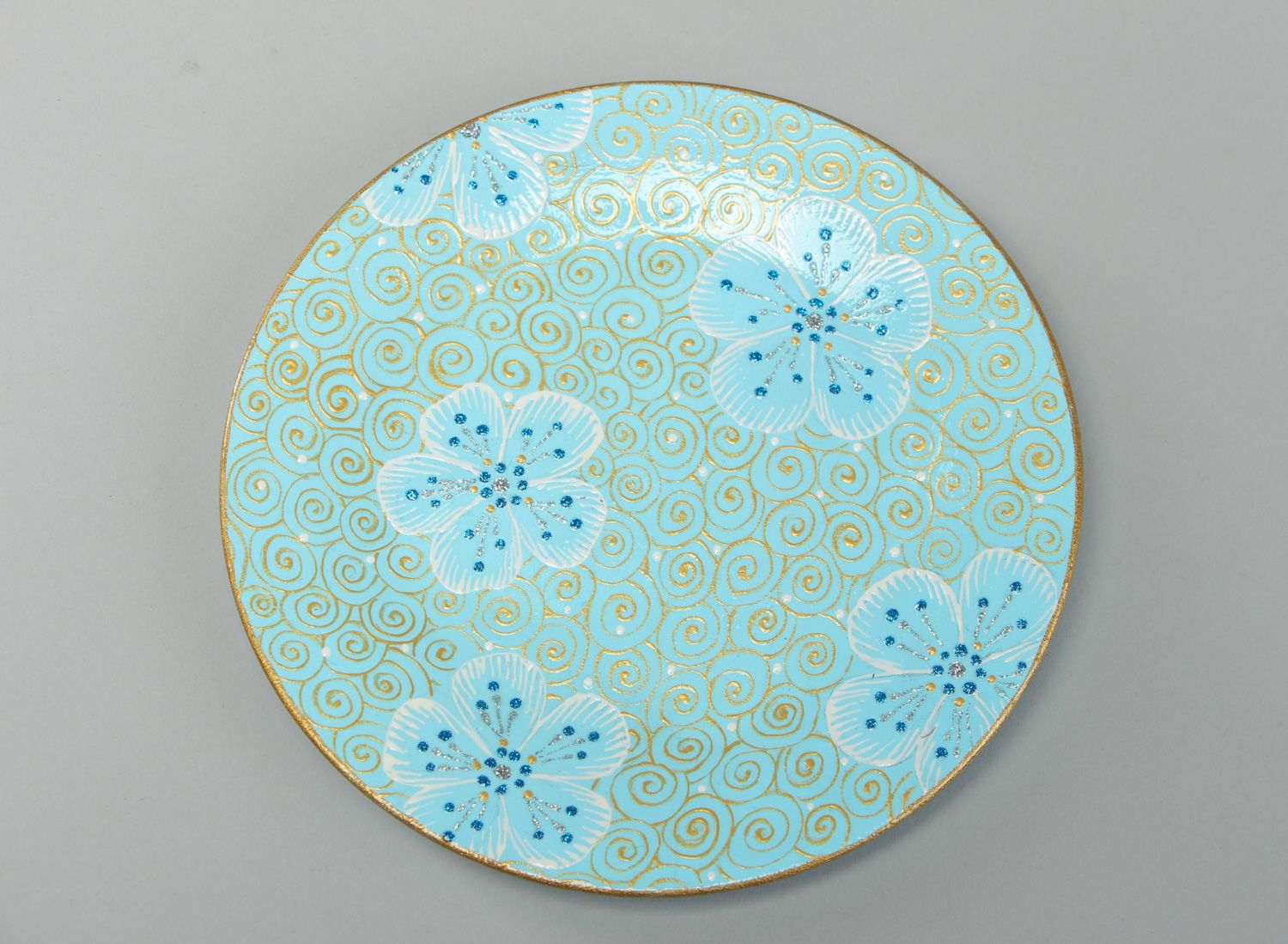 Handmade round ceramic plate with painting in blue color palette for present photo 1