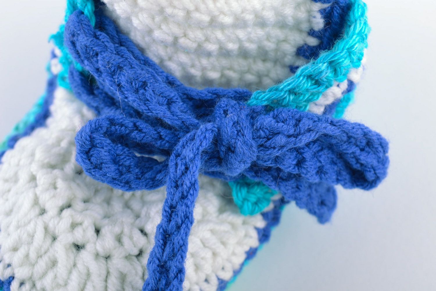 Handmade knitted wool baby booties in blue color palette photo 2