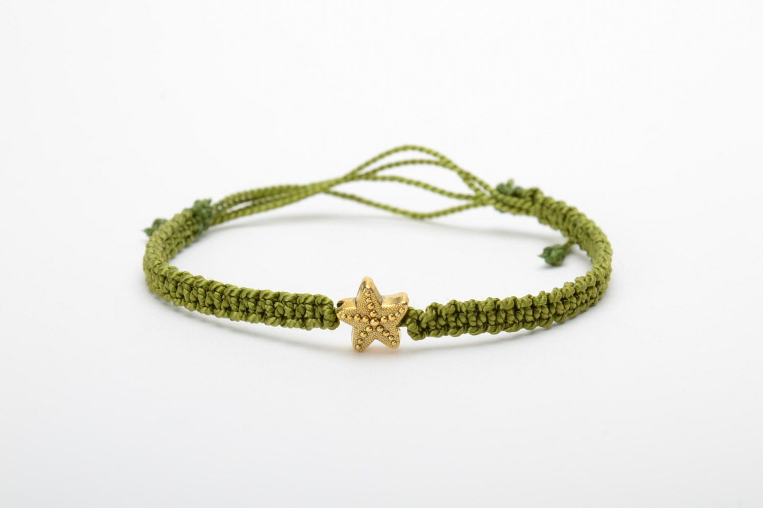 Handmade women's macrame woven bracelet of green color with charm in the shape of star photo 5