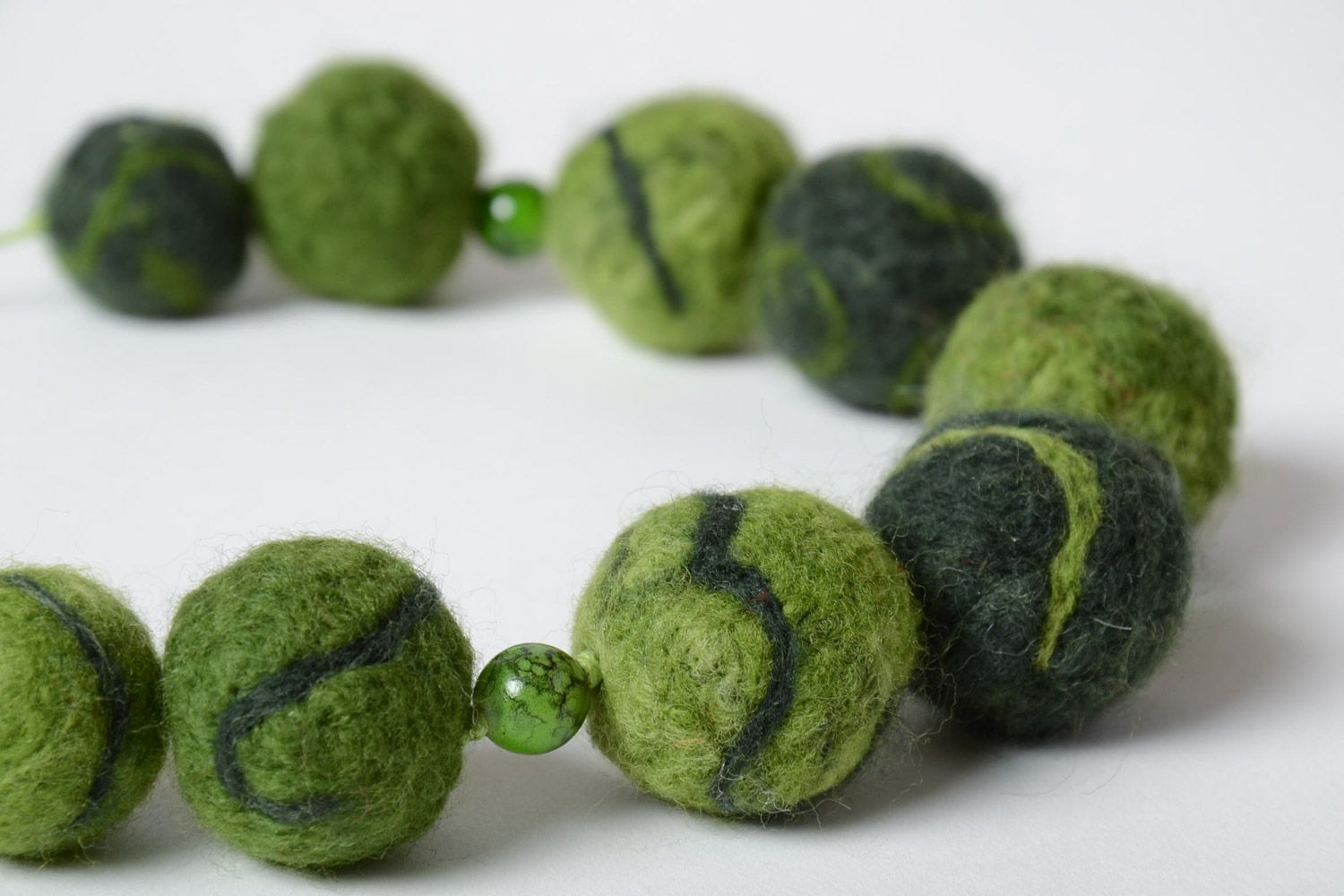 Handmade designer large beaded necklace made of wool using the technique of needle felting in green color photo 3