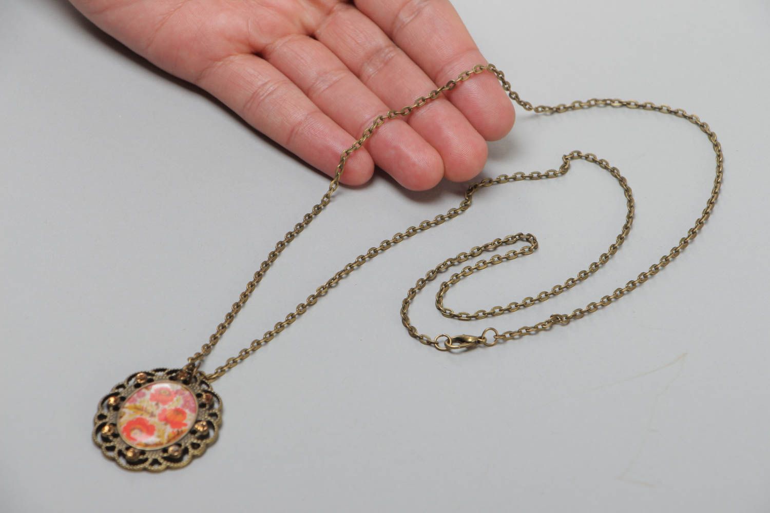Handmade vintage metal pendant with floral image and glass glaze on chain 700 mm photo 5