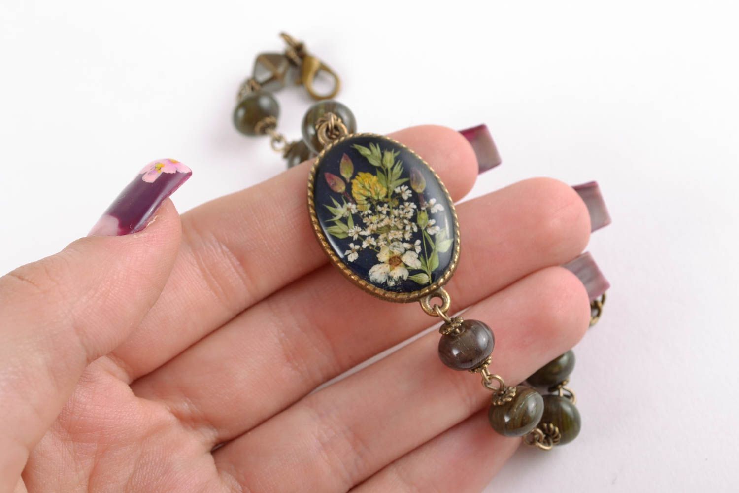 Women's wrist bracelet with dried flowers in epoxy resin photo 1