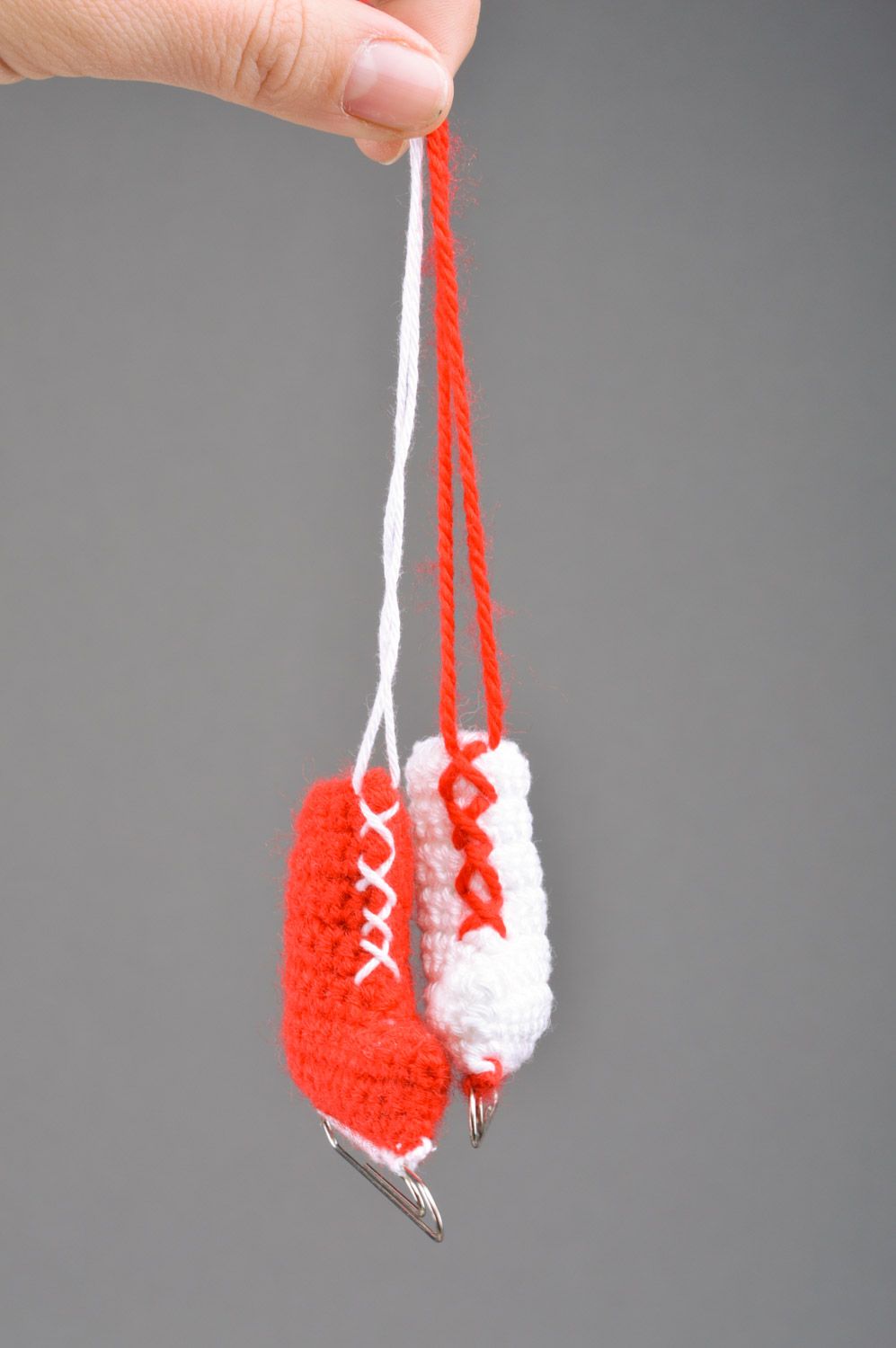 Unusual handmade crochet soft interior pendant in the shape of skates with paper clips photo 3