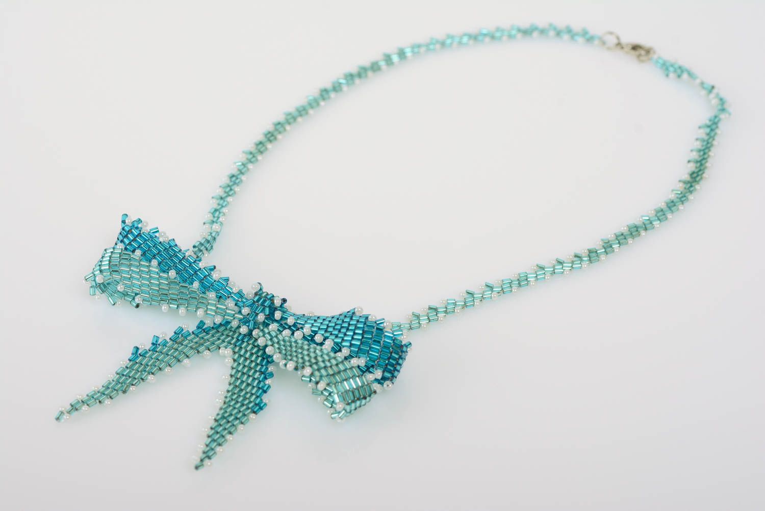 Unusual women's handmade blue beaded necklace with bow stylish jewelry photo 1