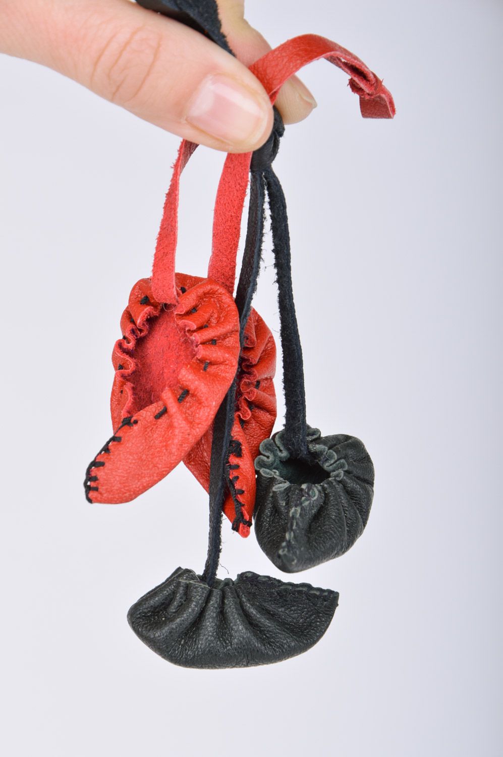 Set of handmade leather keychains 2 items bag charms black and red bast shoes with cords photo 3