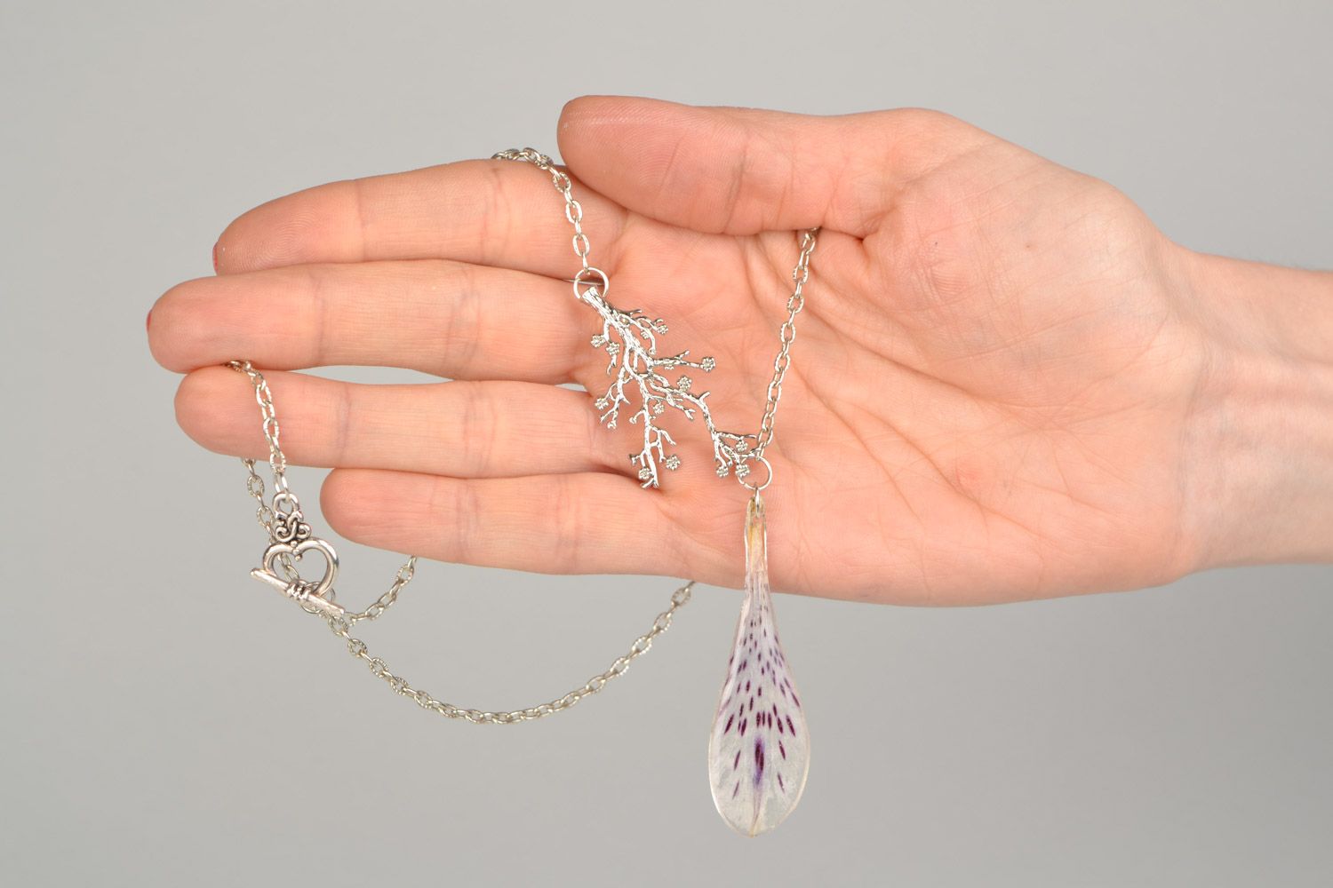 Elegant handmade pendant with alstroemeria petal in epoxy resin on metal chain photo 2
