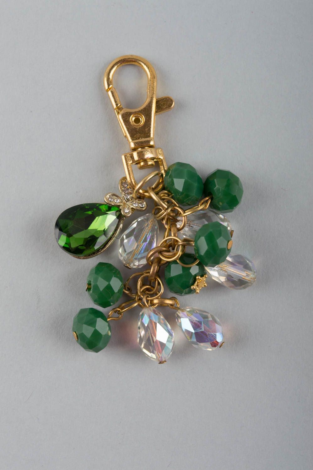 Handmade fashionable keychain with latten basis and green glass beads photo 2