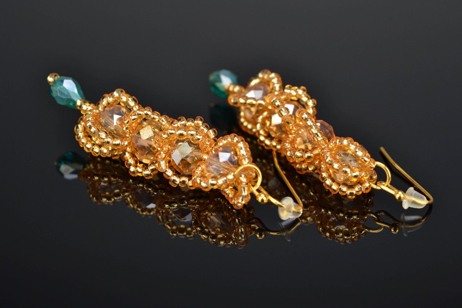 Goldfarbene Ohrringe aus Glasperlen und Kristall  foto 1