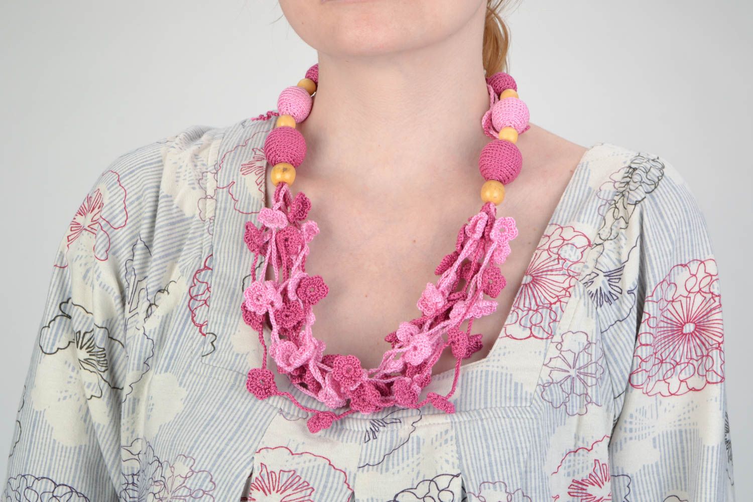 Handmade wooden bead necklace crocheted over with cotton threads of pink color photo 1