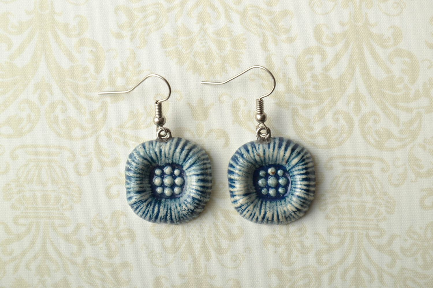 Handmade ceramic earrings with enamel painting of blue and white colors photo 1
