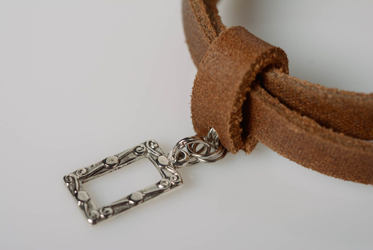 Beautiful handmade designer brown genuine leather bracelet with metal charm photo 2