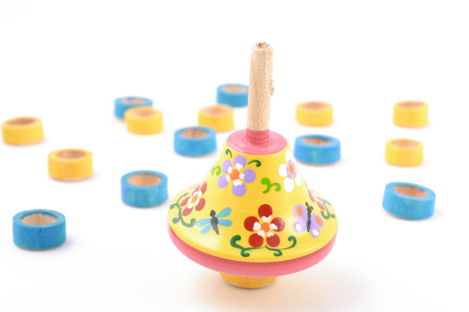 Bright children's handmade wooden spinning top toy painted with eco dyes photo 1