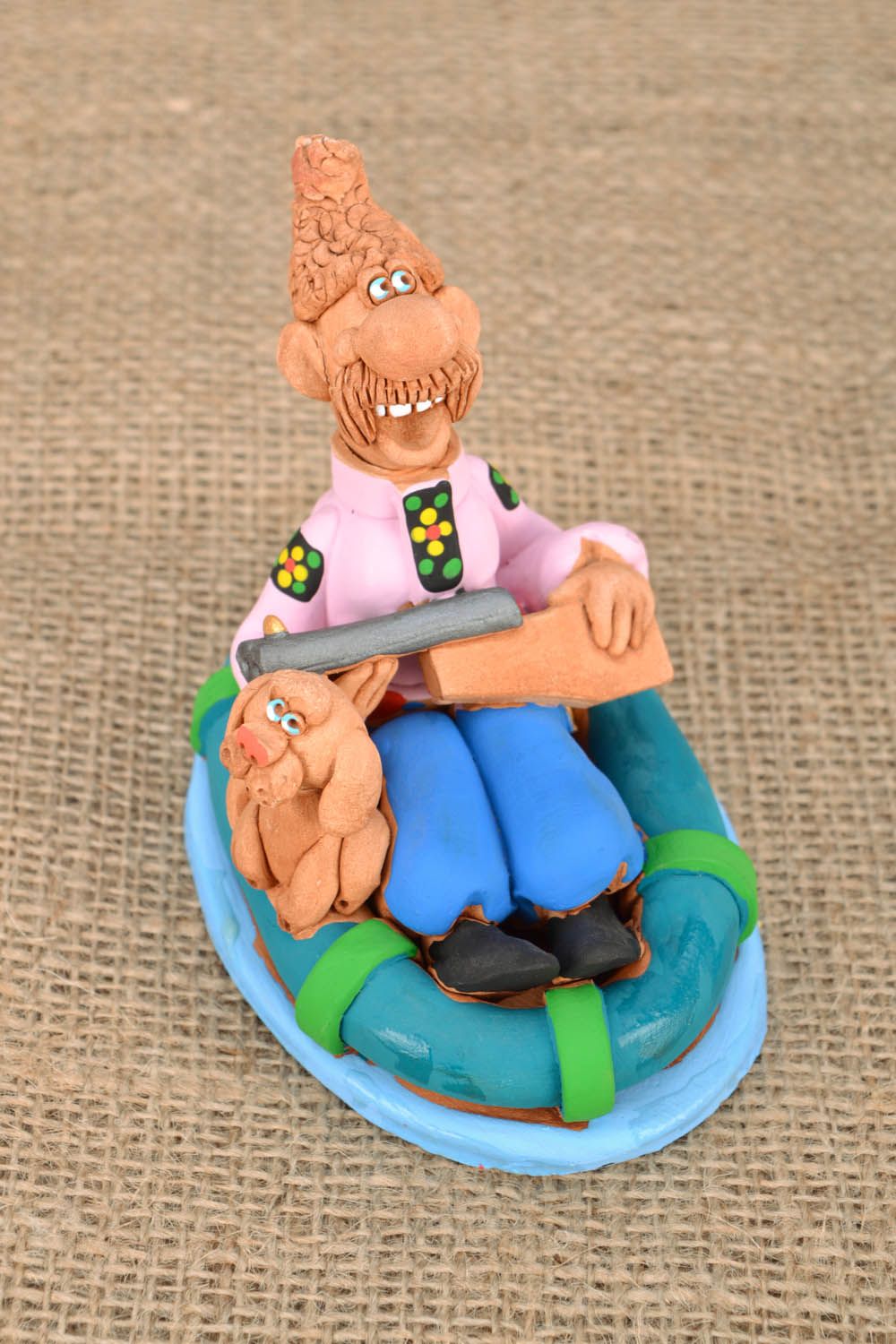 Handmade clay figurine Cossack in a Boat photo 1