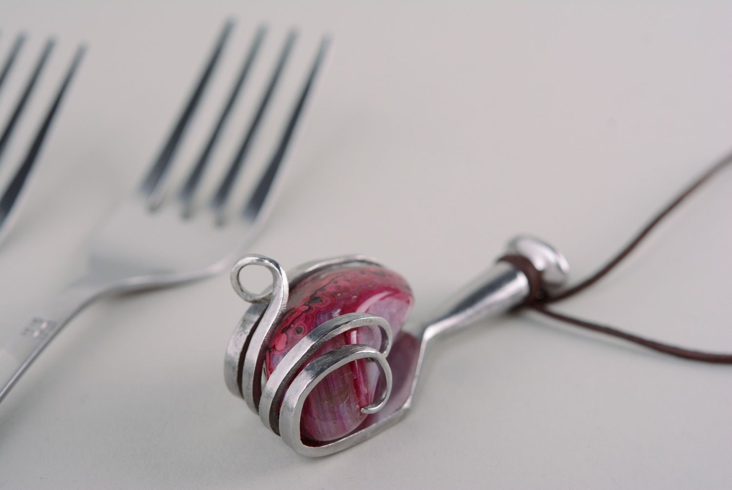 Handmade metal pendant made of cupronickel fork with claret stone photo 1
