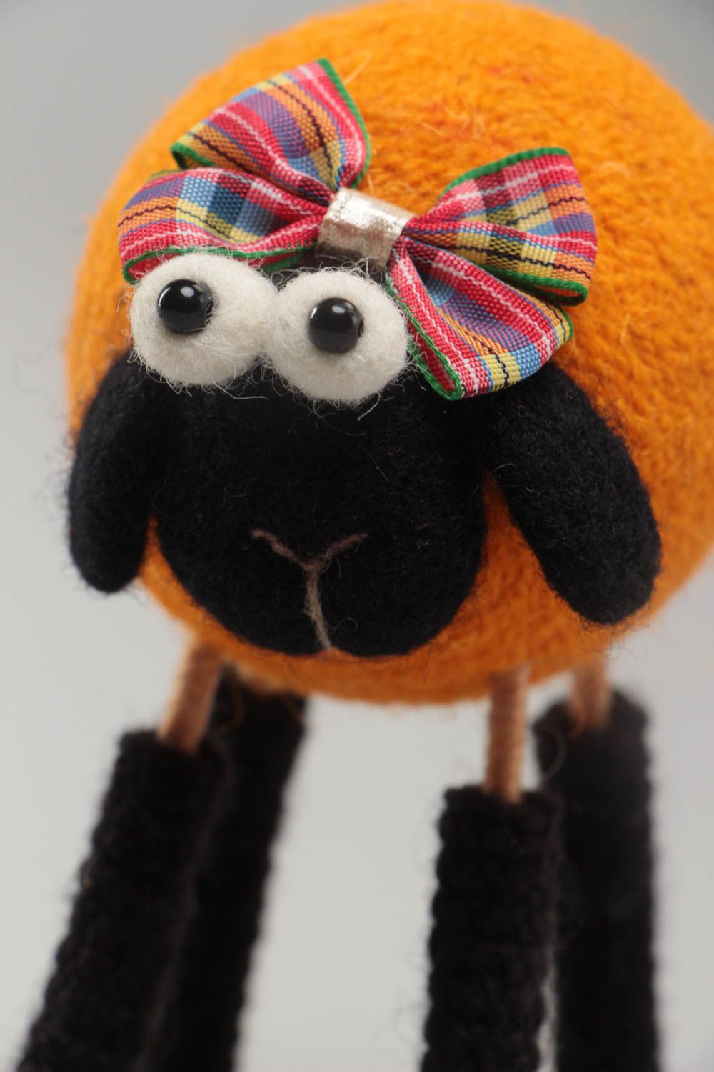 Handmade funny soft toy crocheted and felted of wool orange lamb on wooden paws photo 3