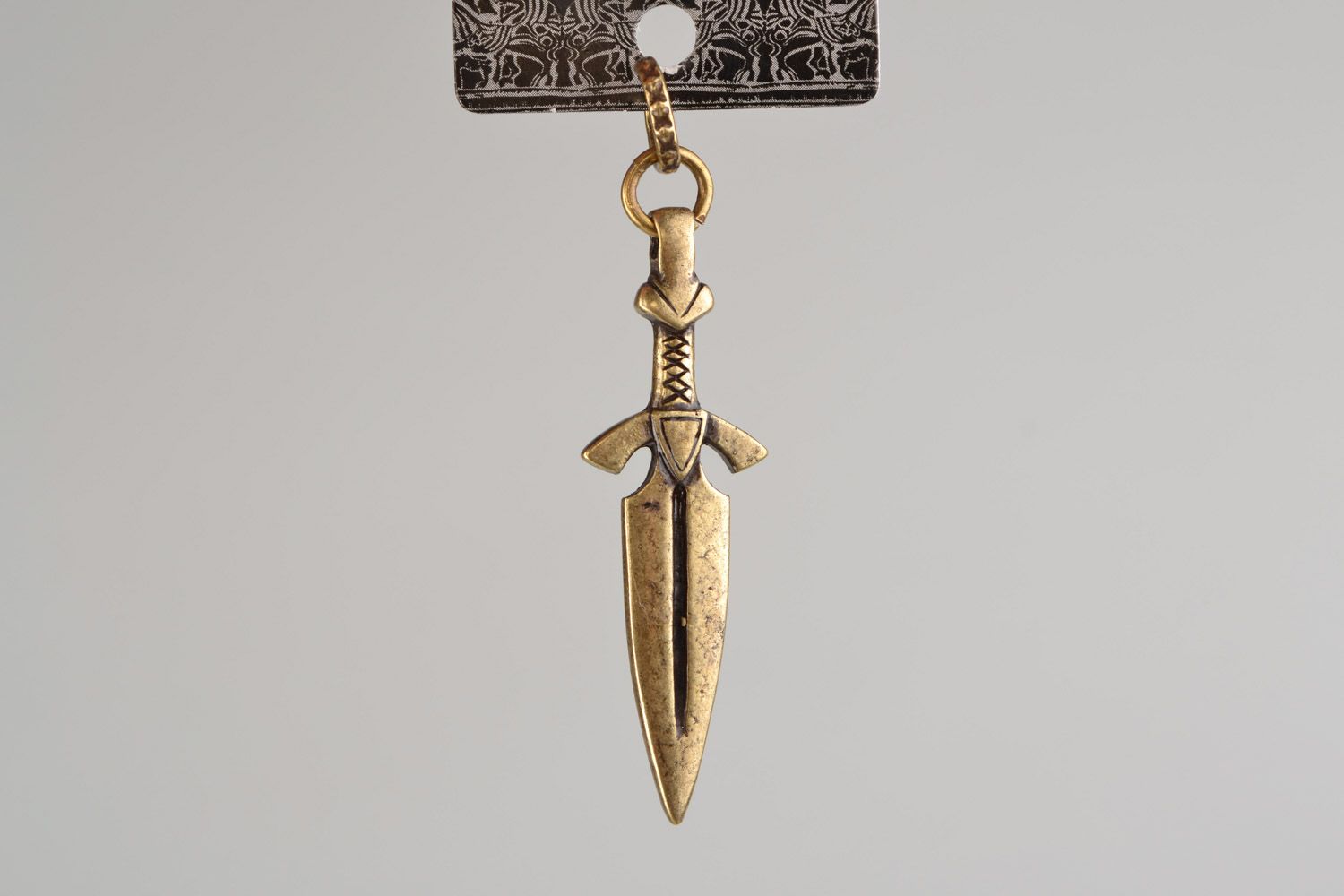 Handmade pendant in the shape of bronze knife cast with the use of permanent mold photo 3