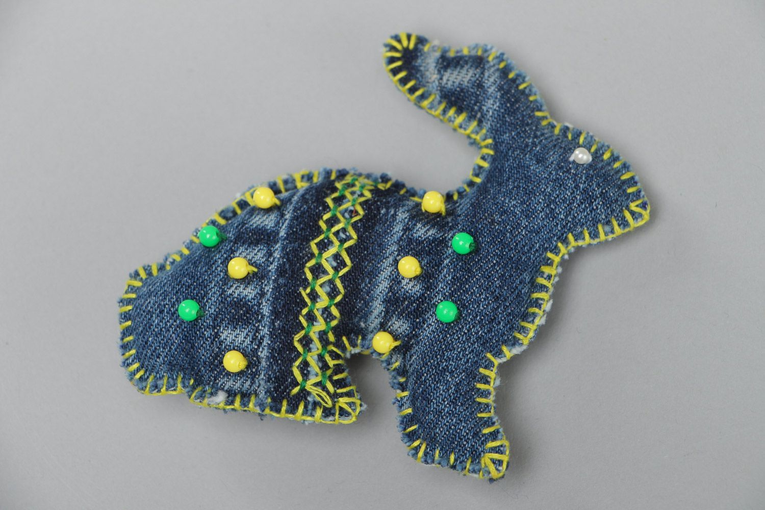 Small homemade soft toy sewn of denim fabric embroidered with beads Rabbit photo 2