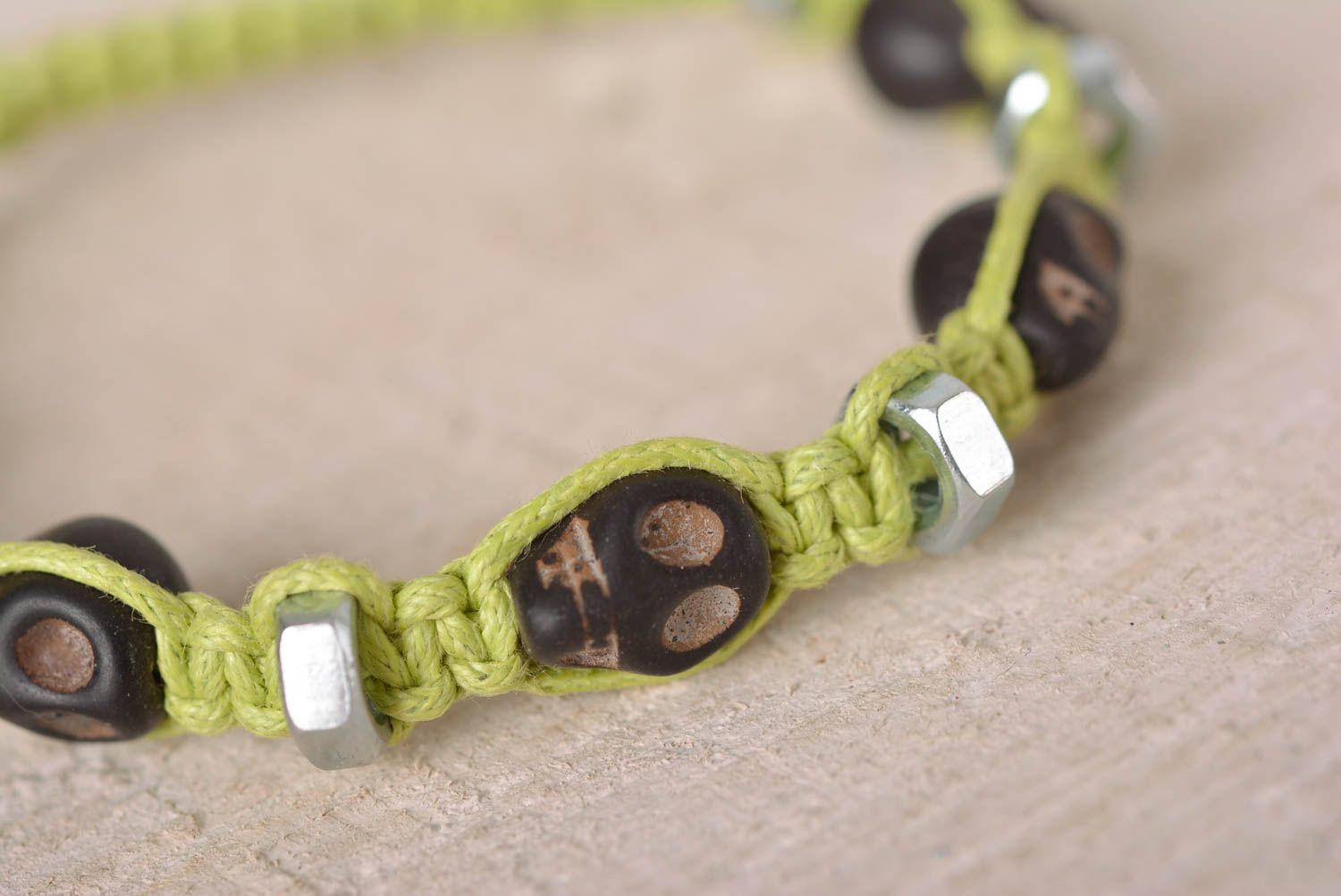 Handmade black skull color beads on light green cord bracelet with female screws photo 2