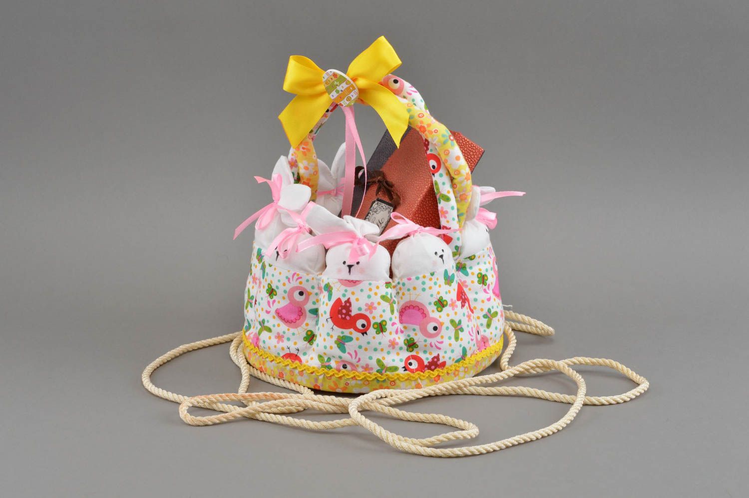 Beautiful Easter interior basket sewn of fabric manually Rabbits in park photo 1