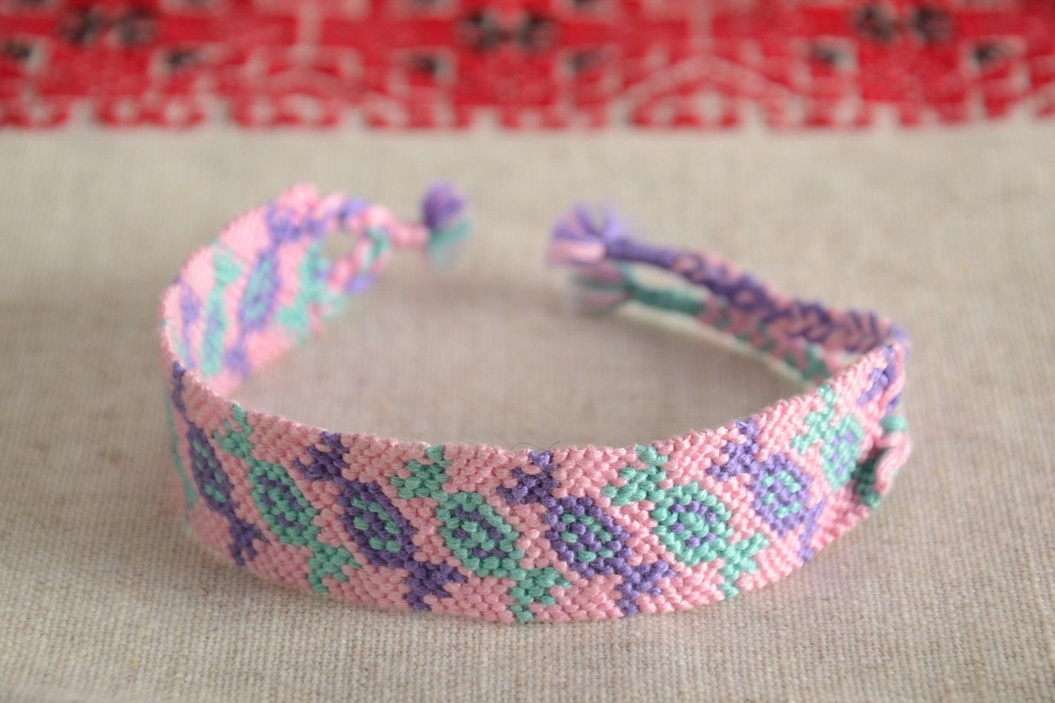 Handmade friendship wrist bracelet woven of pink and violet threads Candies photo 1