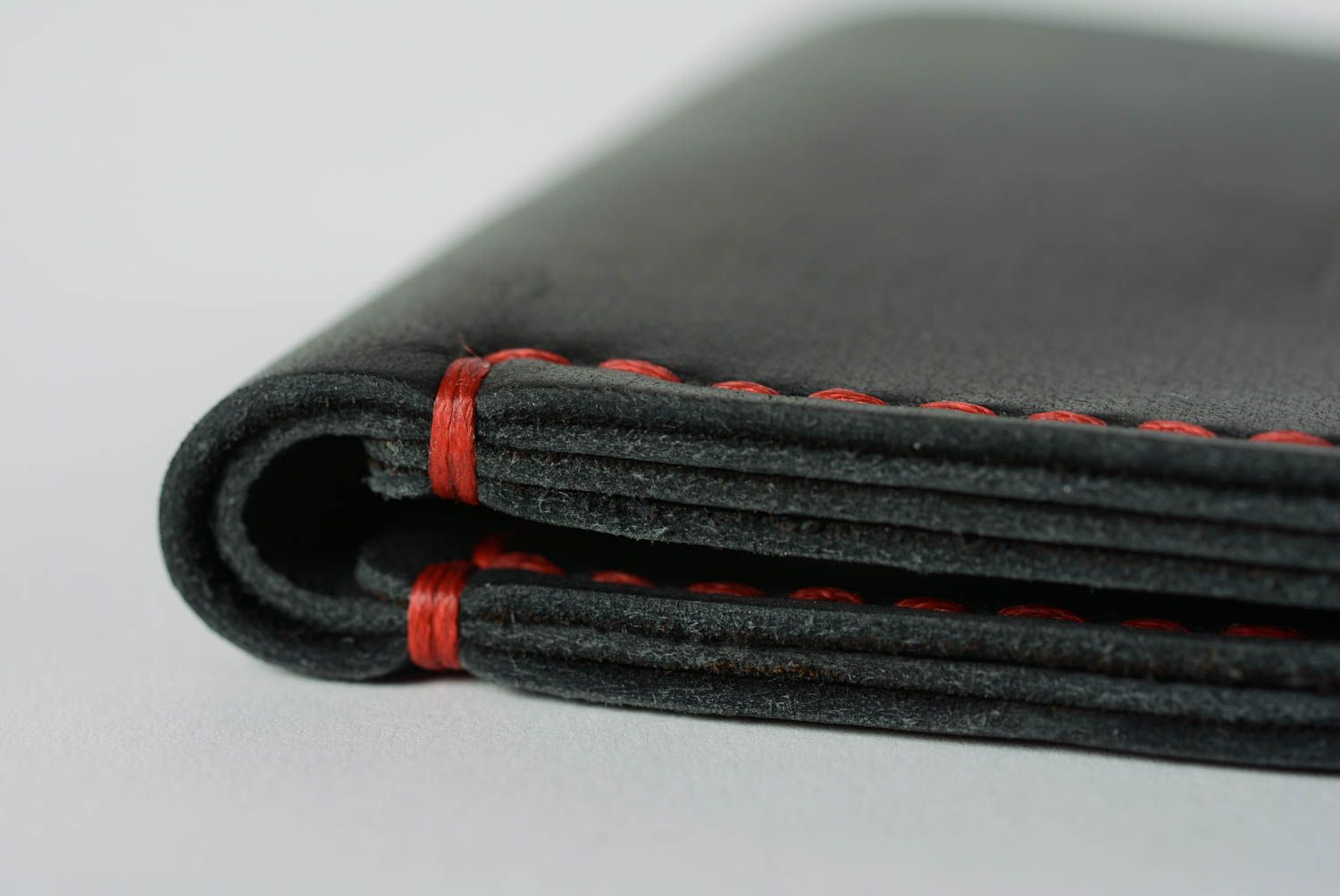 Handmade black genuine leather wallet with embossing stitched with red threads photo 5