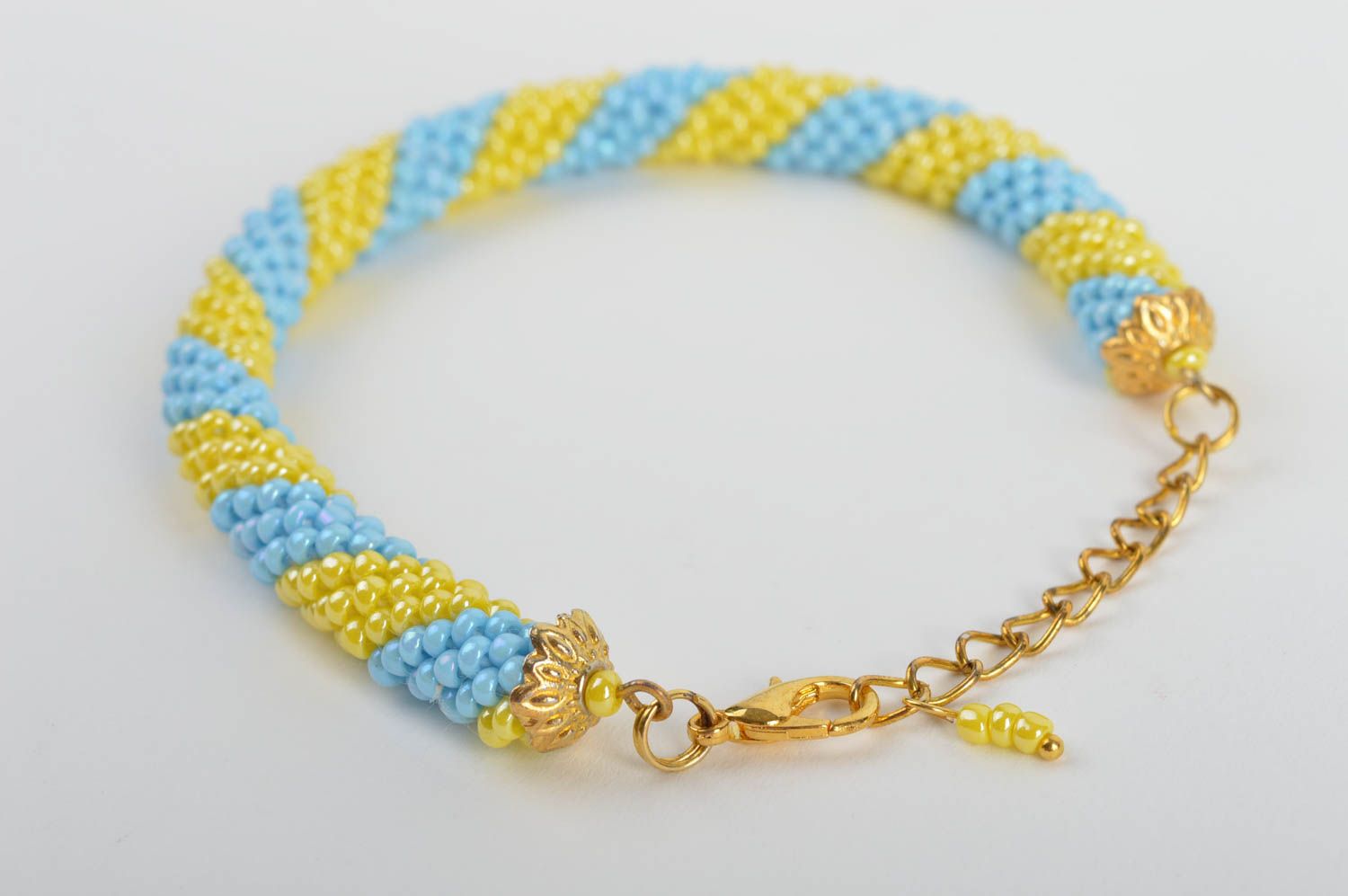 Handmade beaded cord wrist bracelet in blue and yellow colors for women photo 3