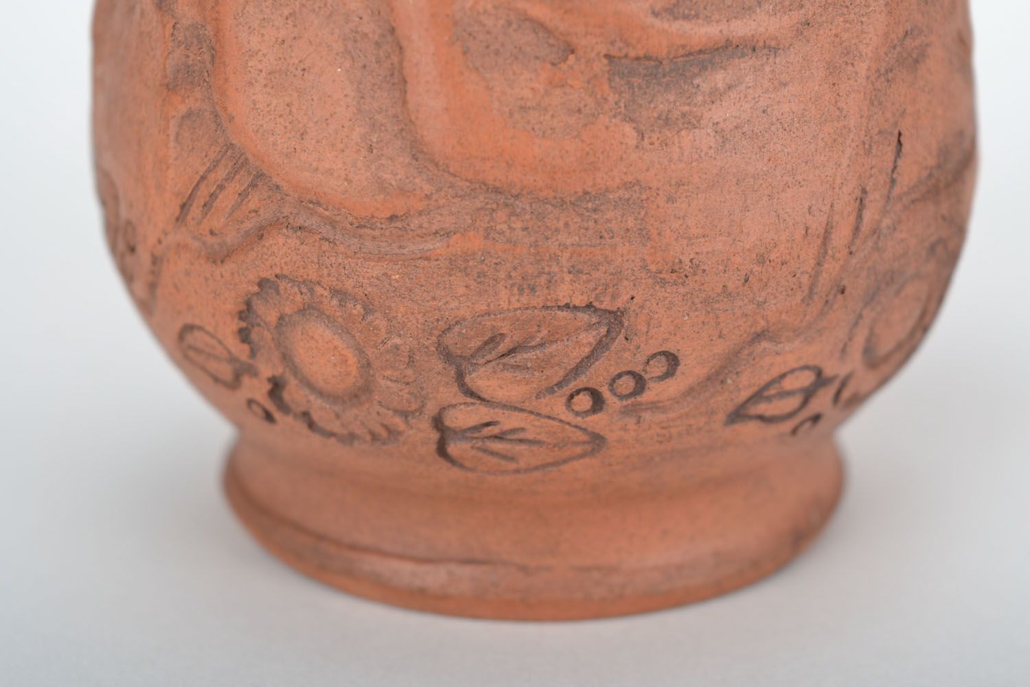 Red clay drinking cup with rustic floral pattern photo 4