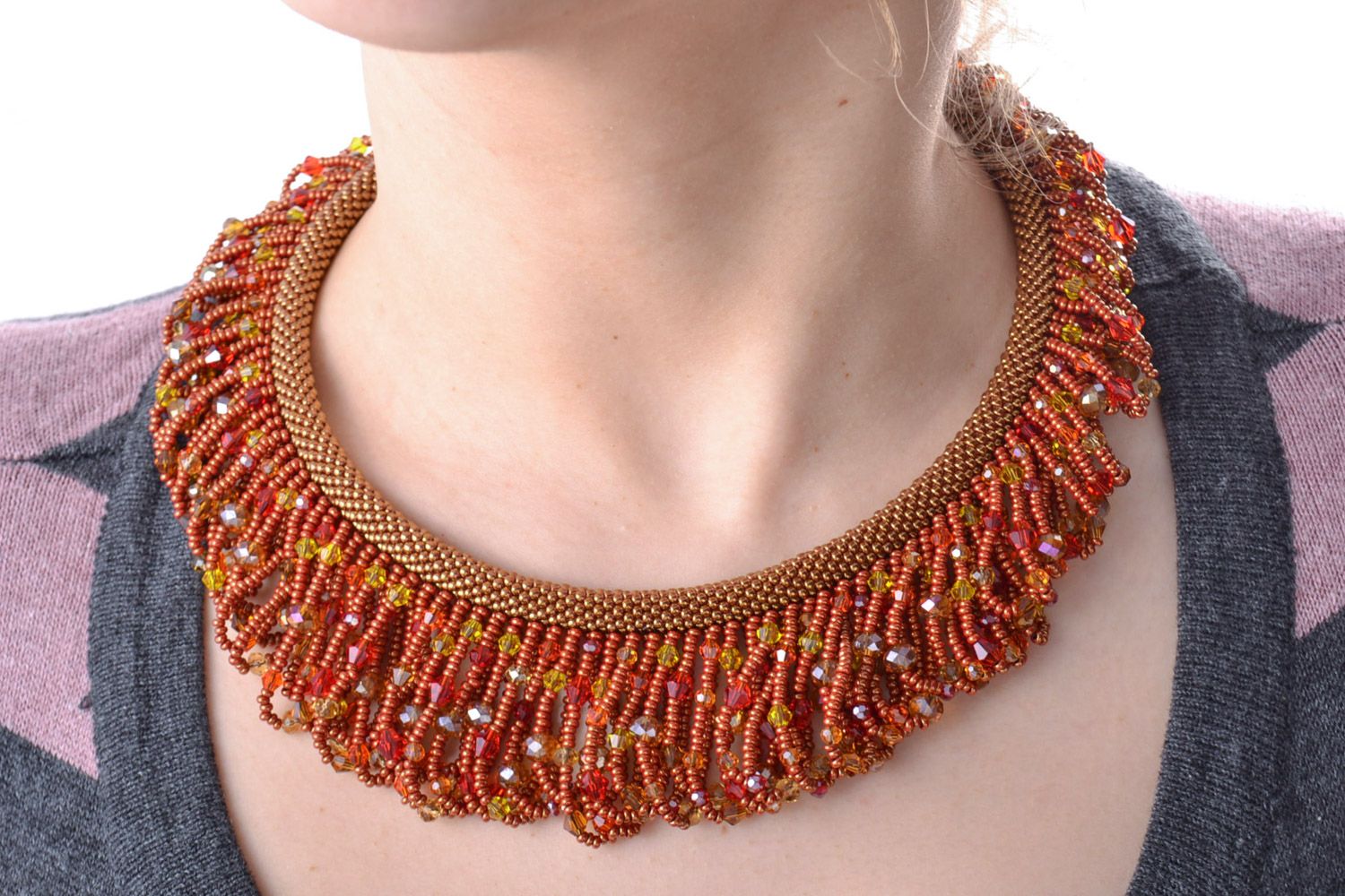 Massive handmade necklace woven of beads with fringe in warm color palette photo 1
