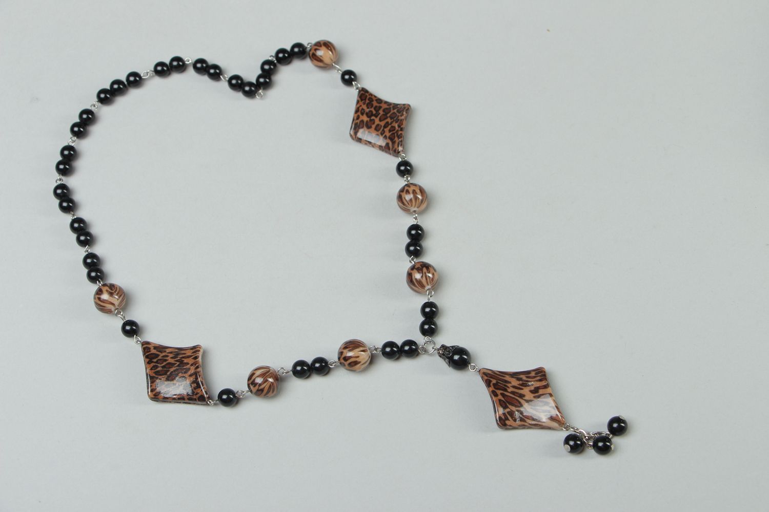 Handmade plastic bead necklace with metal Tiger photo 1