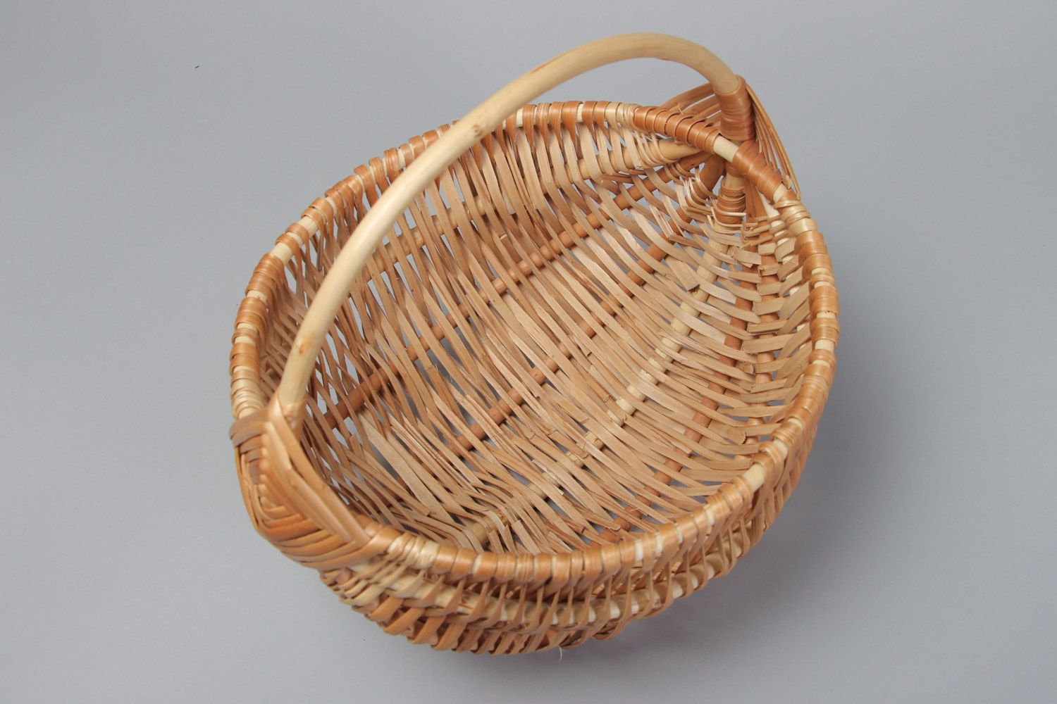 Small beautiful handmade Easter basket woven of willow withe of light color photo 3