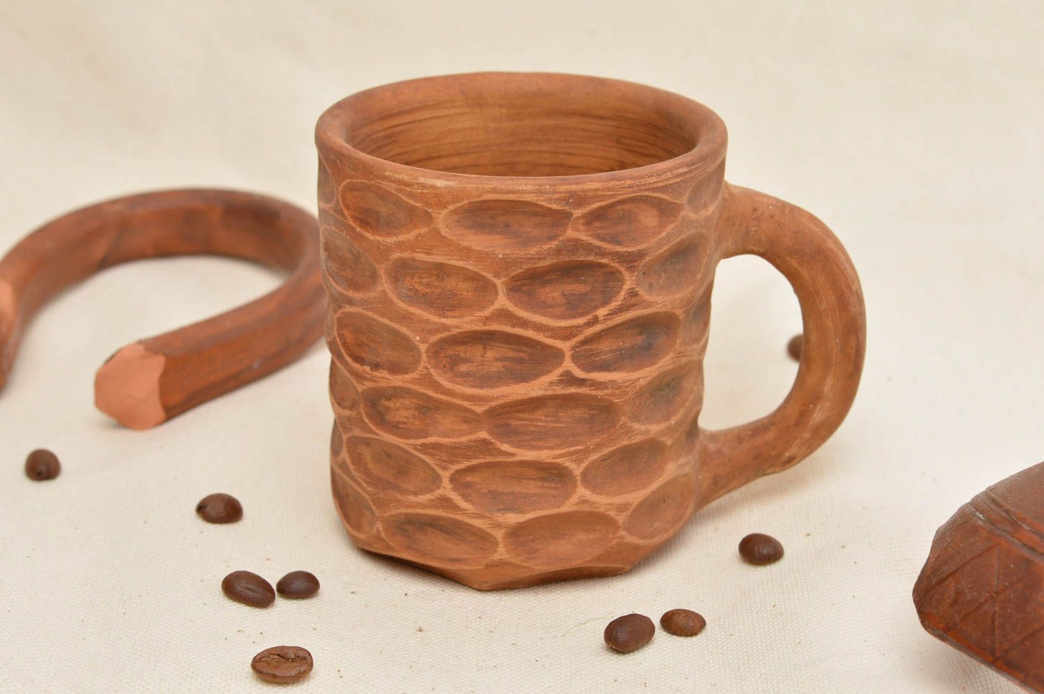 Clay handmade drinking cup with fingerprint design and handle photo 1