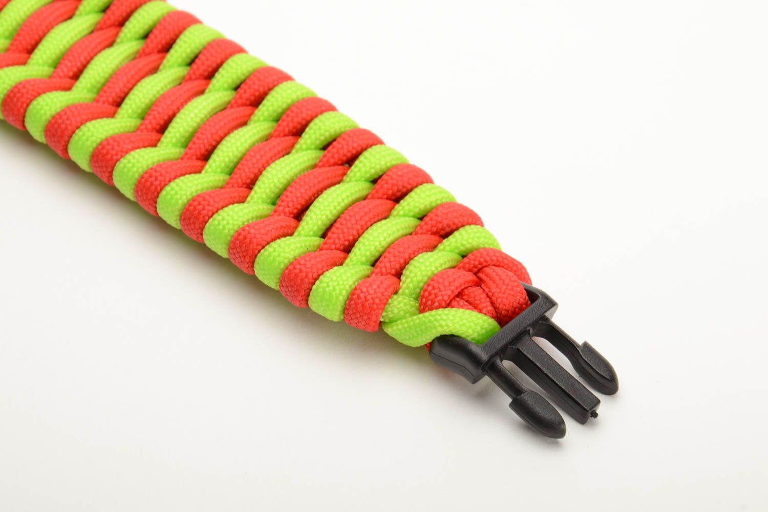 Handmade wrist survival bracelet woven of bright paracords with plastic fastener photo 2