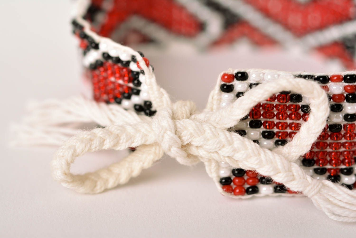 Handmade beaded bracelet with Ukrainian style ornament in red, black, and white color photo 5