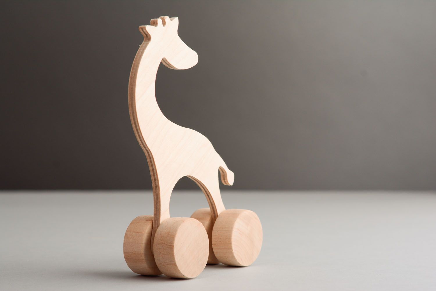 Деревянная игрушка в виде жирафа фото 2