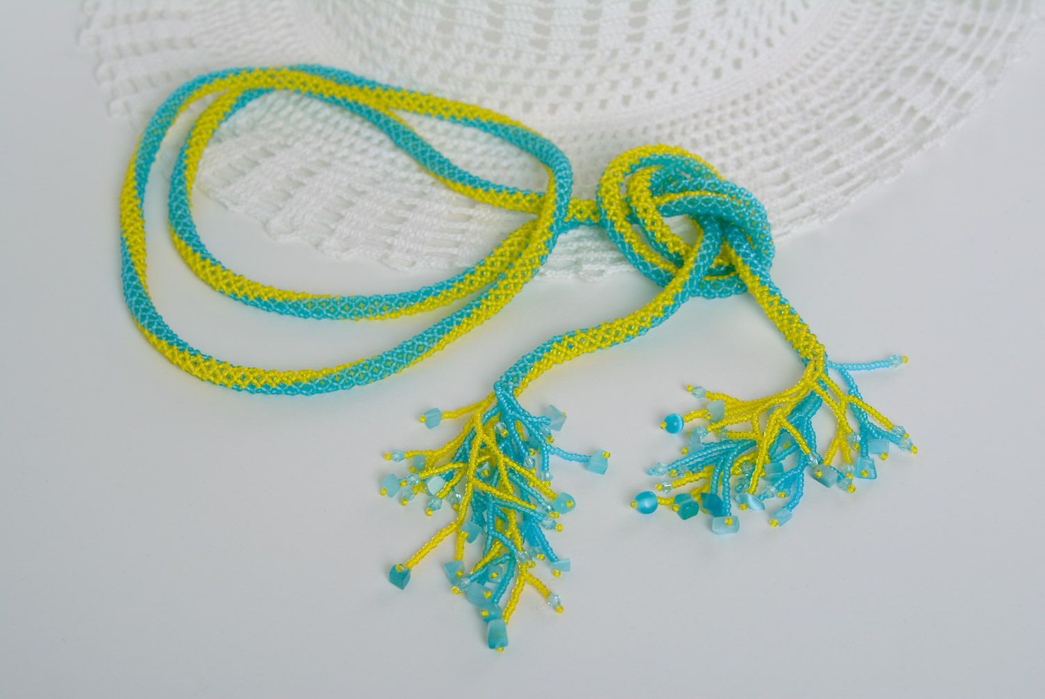 Beautiful long handmade necklace woven of beads of yellow and blue colors photo 1