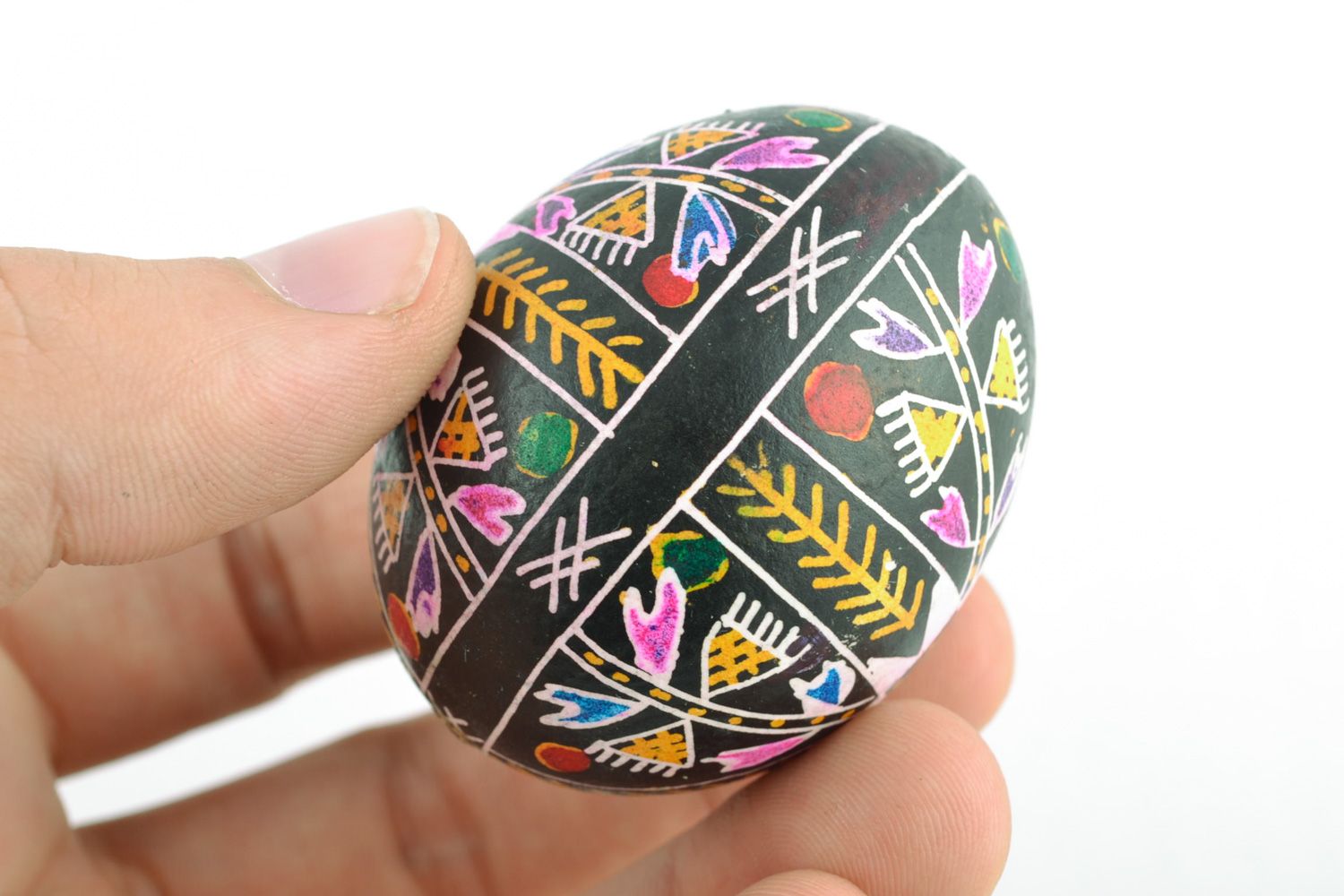 Handmade black Easter egg with rich pattern painted with wax and aniline dyes photo 2