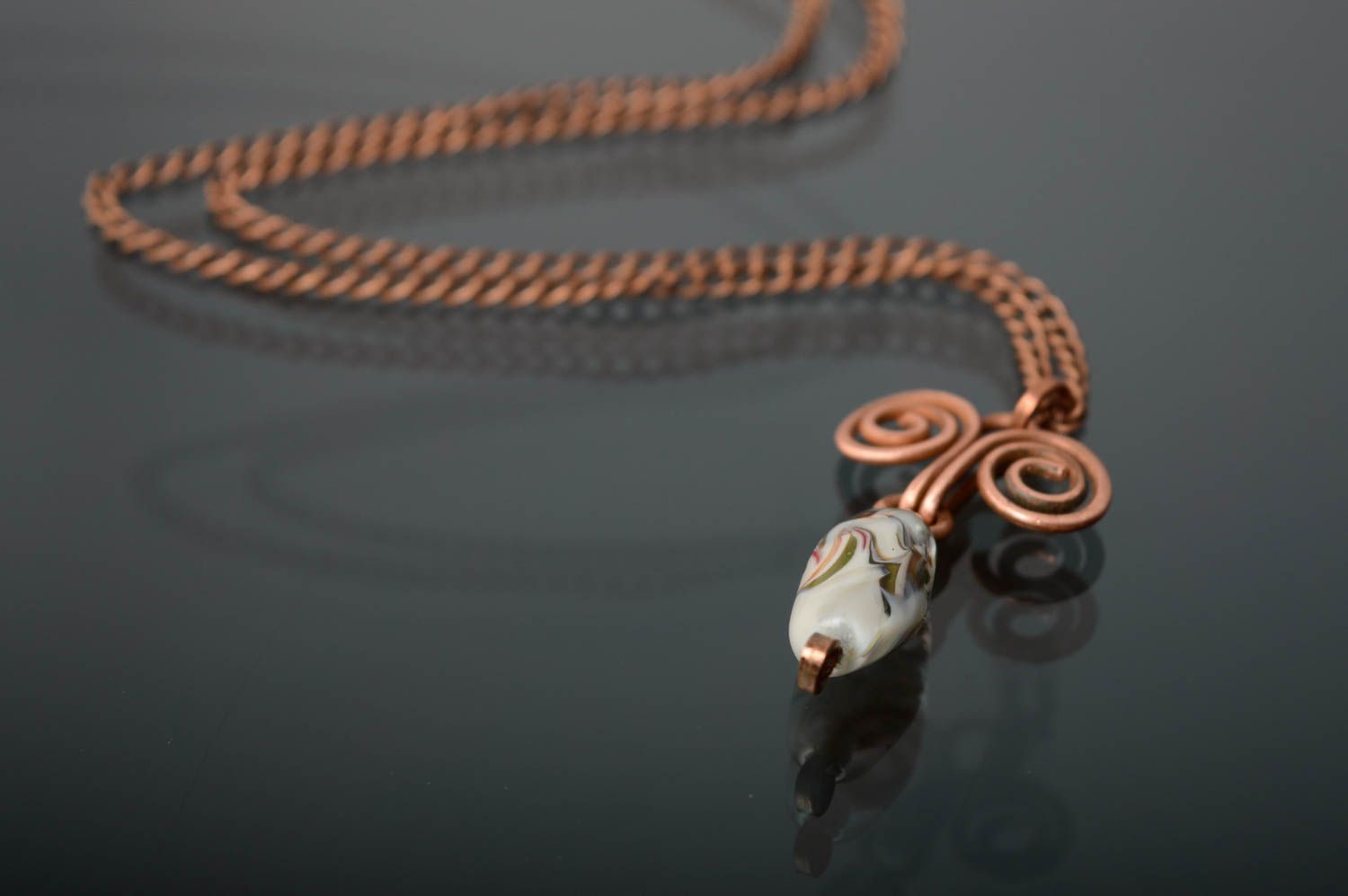 Copper pendant made using wire wrap technique photo 1