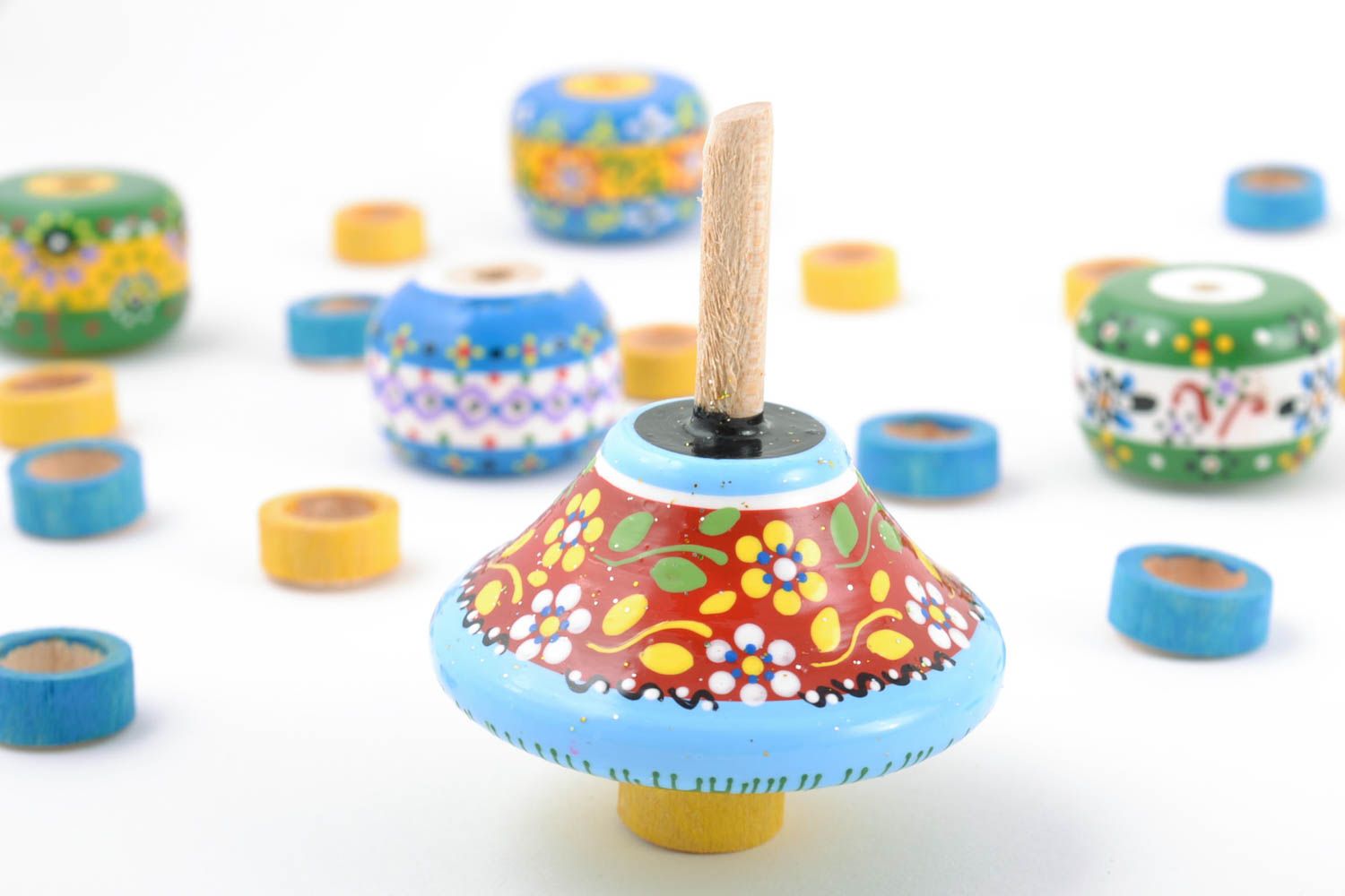 Handmade small wooden spinning top toy painted brightly with eco dyes for kids photo 1
