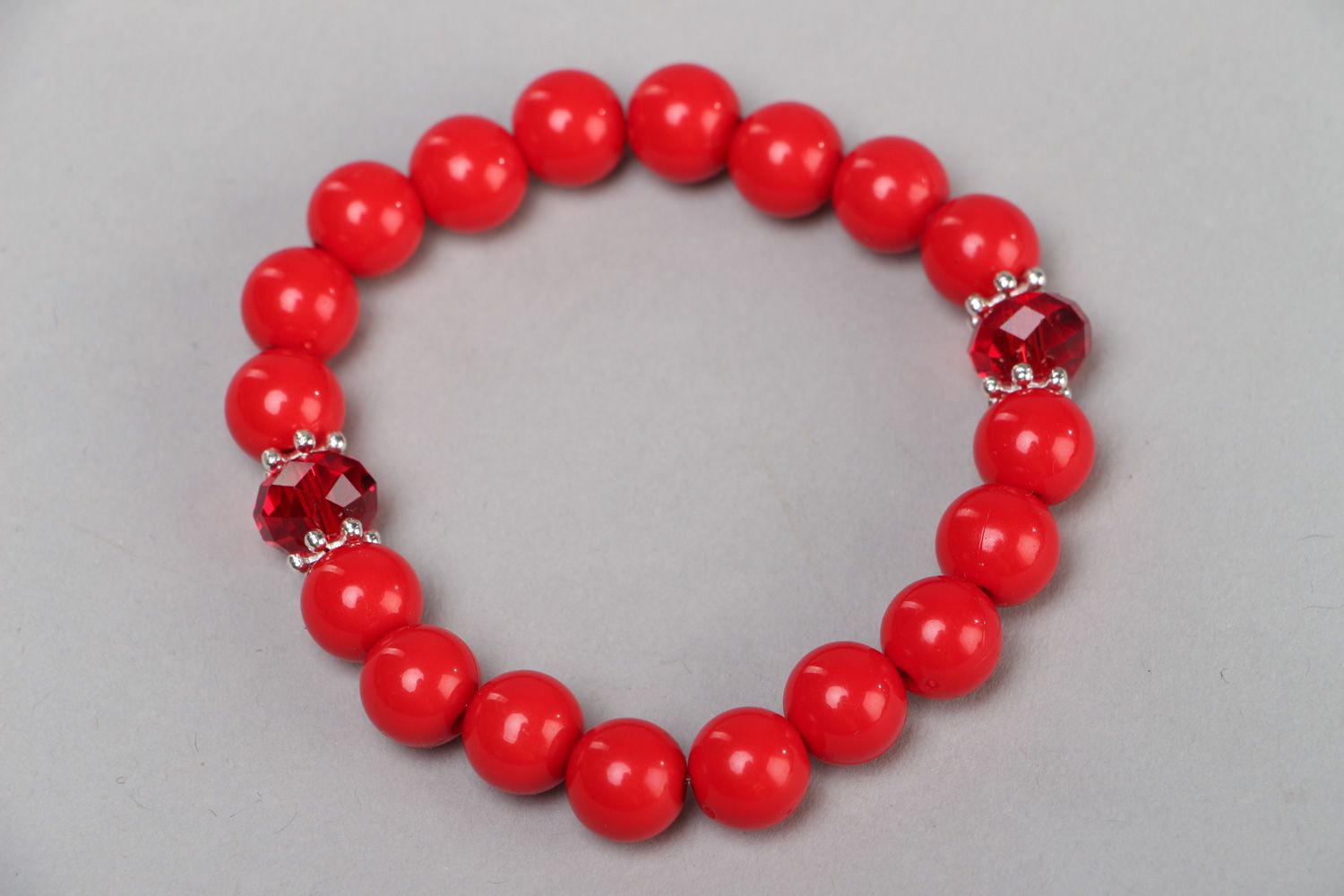 Handmade wrist bracelet with bright red plastic and glass beads for women photo 2