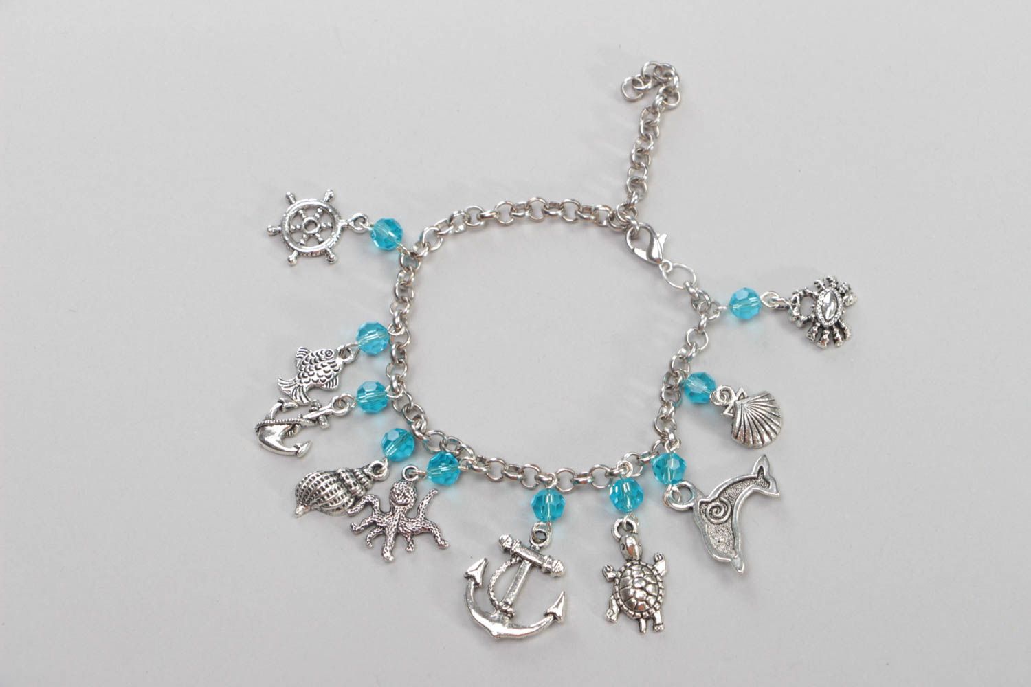 Handmade crystal bracelet accessory with metal charms stylish designer jewelry photo 2