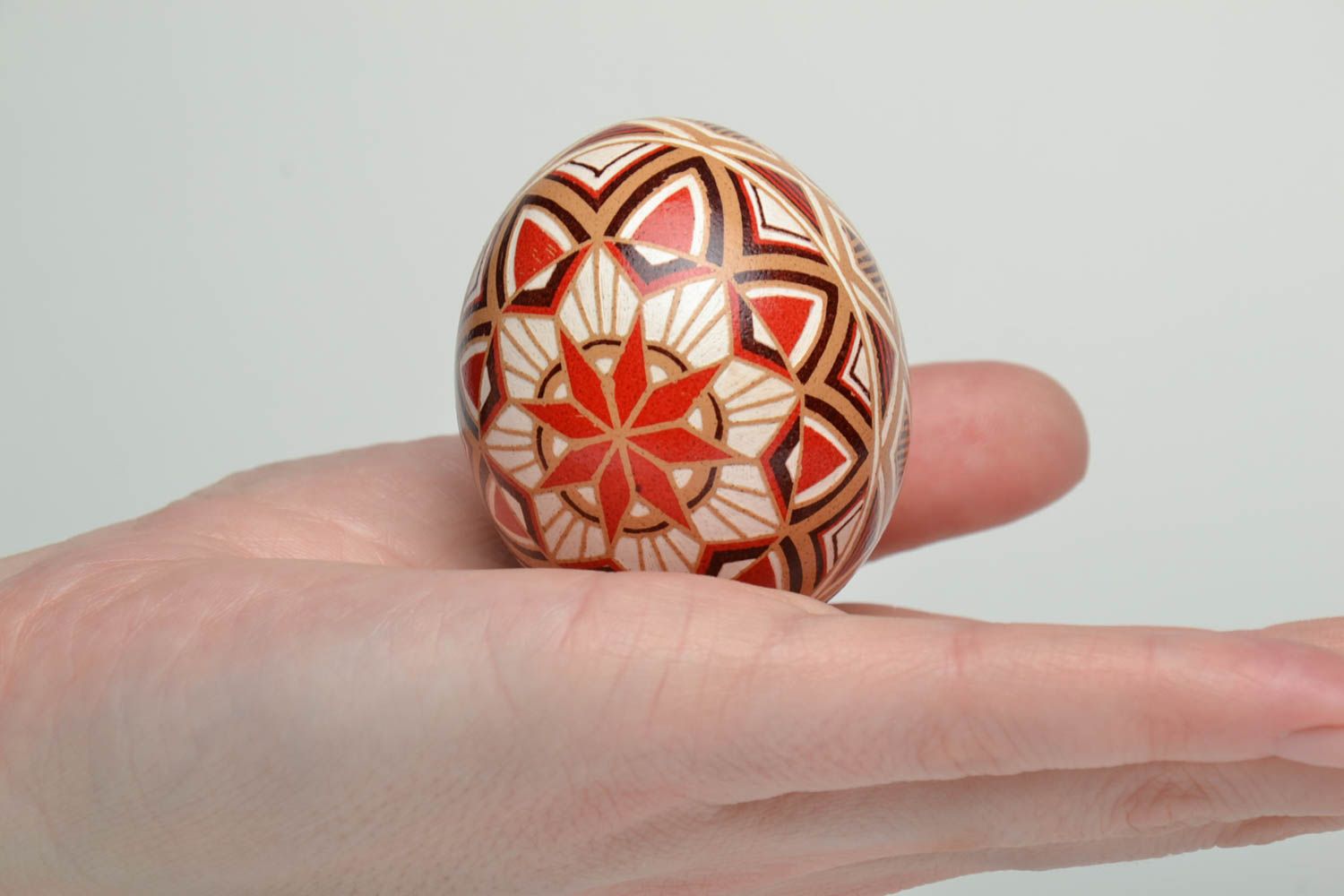Handmade pysanka painted with hot wax with traditional symbols photo 5