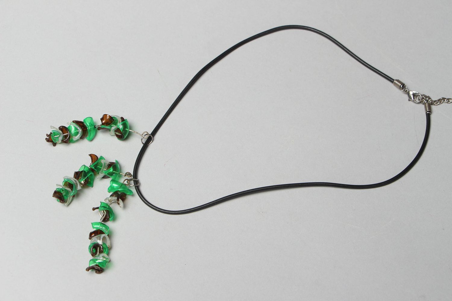 Green plastic pendant on cord photo 1