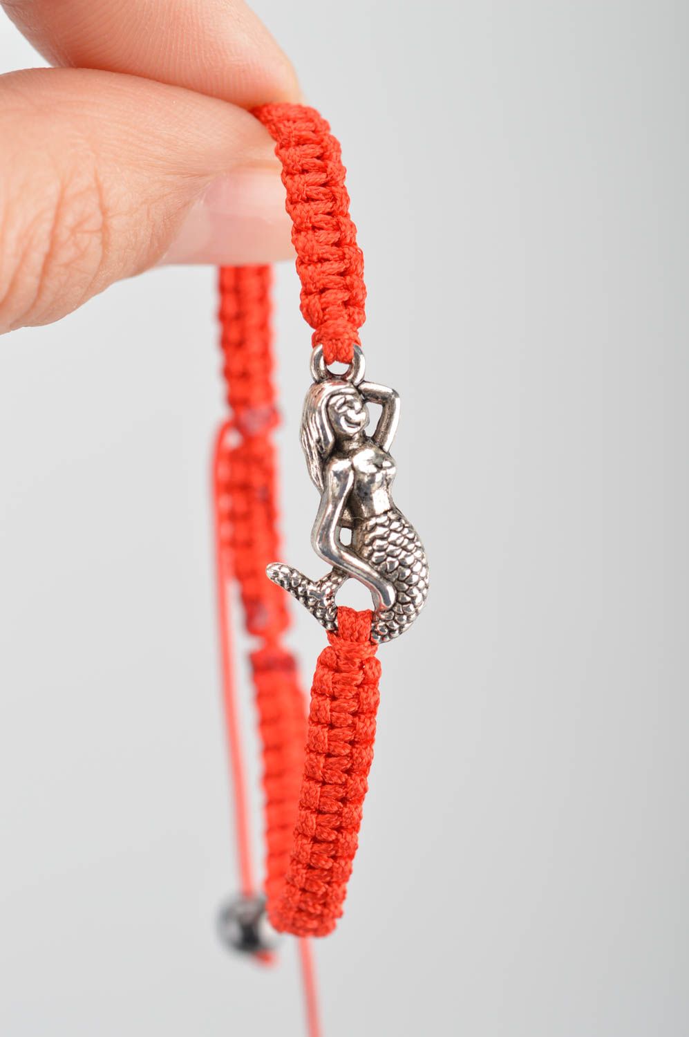 Handmade woven thin cute red bracelet made of silk threads with mermaid photo 3