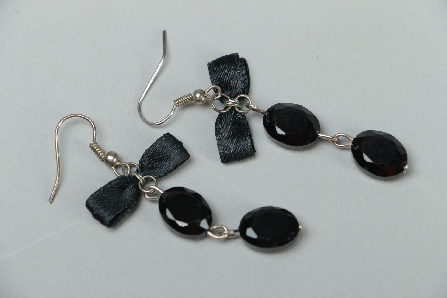 Black earrings with beads and bows photo 1