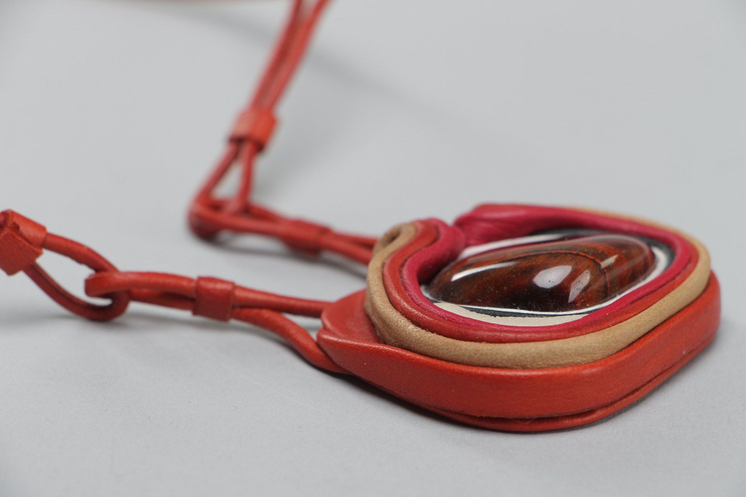 Handmade stylish designer pendant made of genuine leather with red stone  photo 3