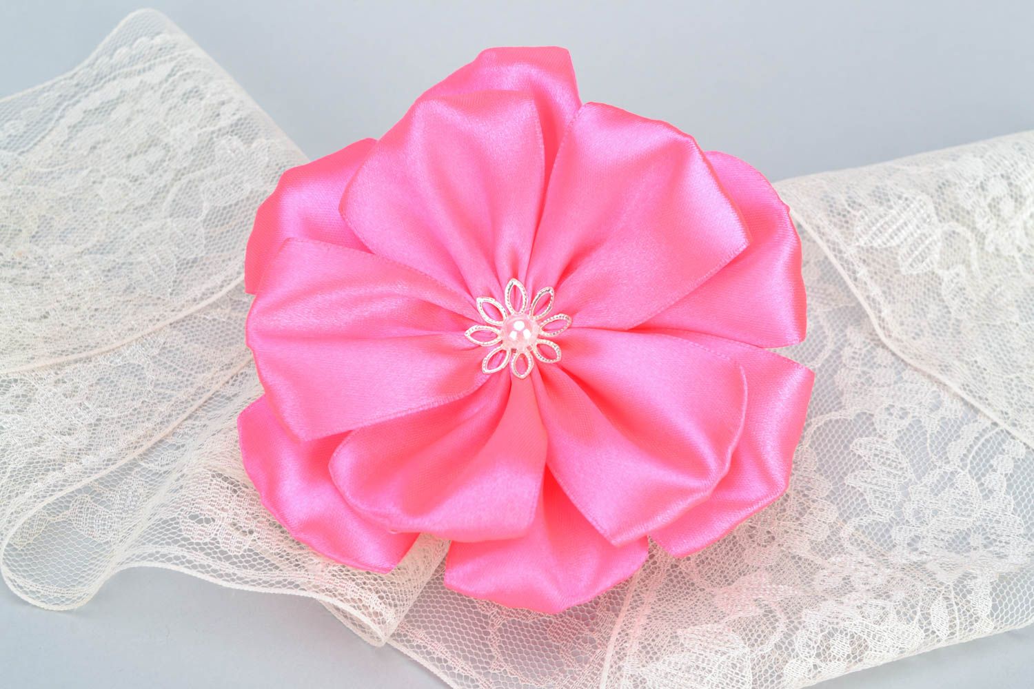 Handmade pink kanzashi satin ribbon flower hair tie photo 1