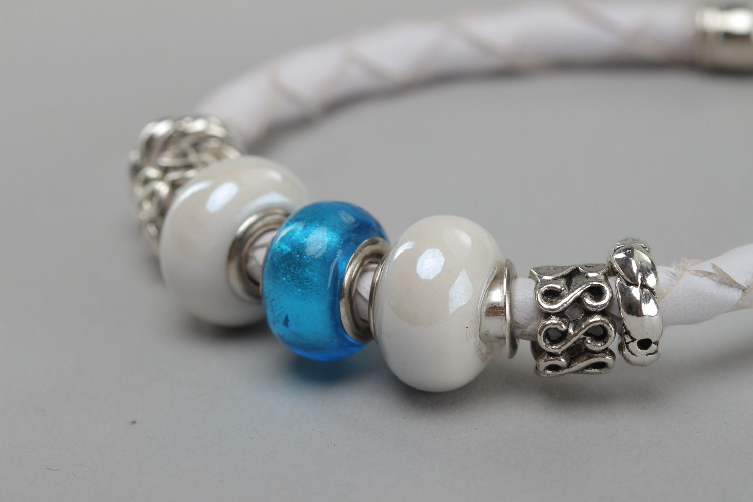 Tender handmade wrist bracelet woven of white faux leather with beads for women photo 3