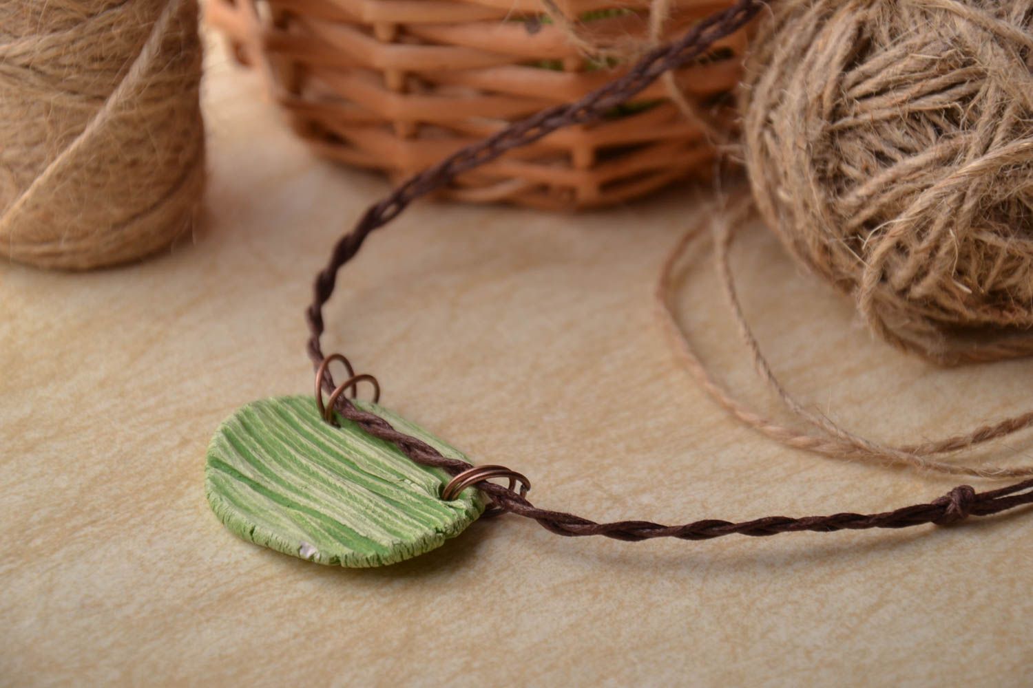 Clay pendant with cord photo 1