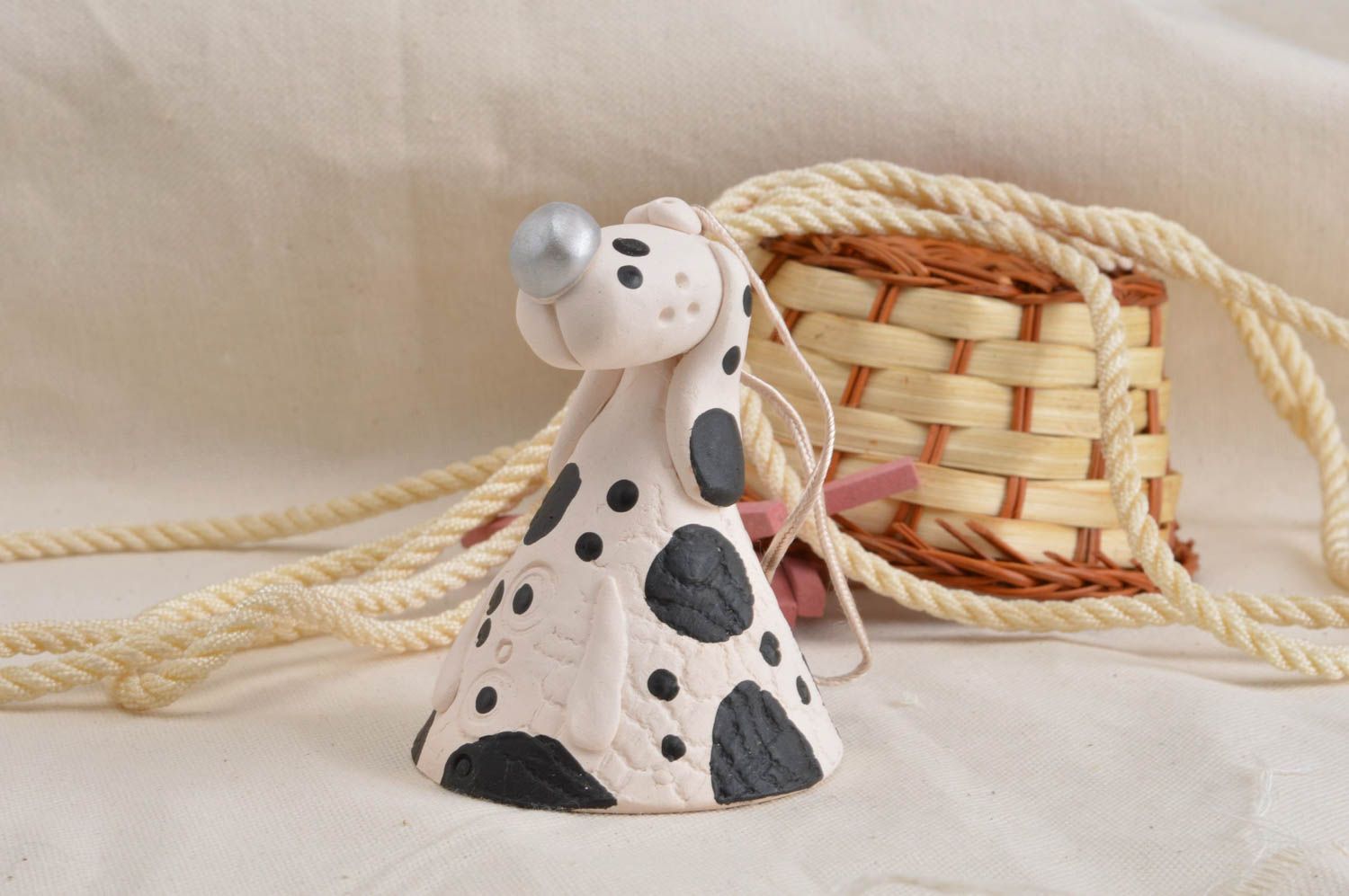 Souvenir designer handmade clay bell with painting Black and white dog photo 1